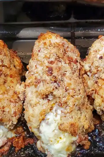 Italian sausage stuffed chicken breasts fresh from the oven. Cleveland cooking. cheese is coming out the front of them.