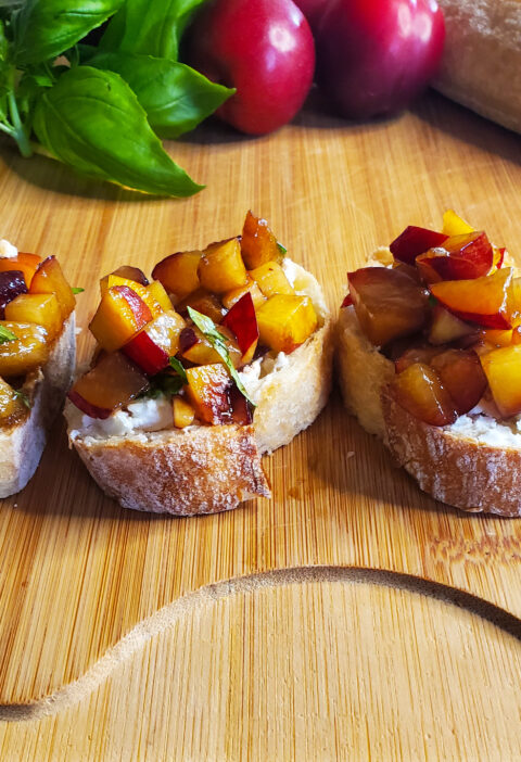 plum and peaches mixed with basil on bruchetta from cleveland cooking plum and peach bruschetta recipe