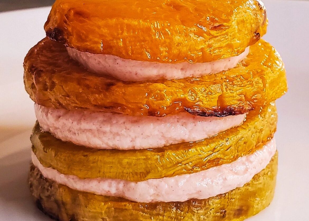 Roasted yellow beets layered with red plum goat cheese sauce