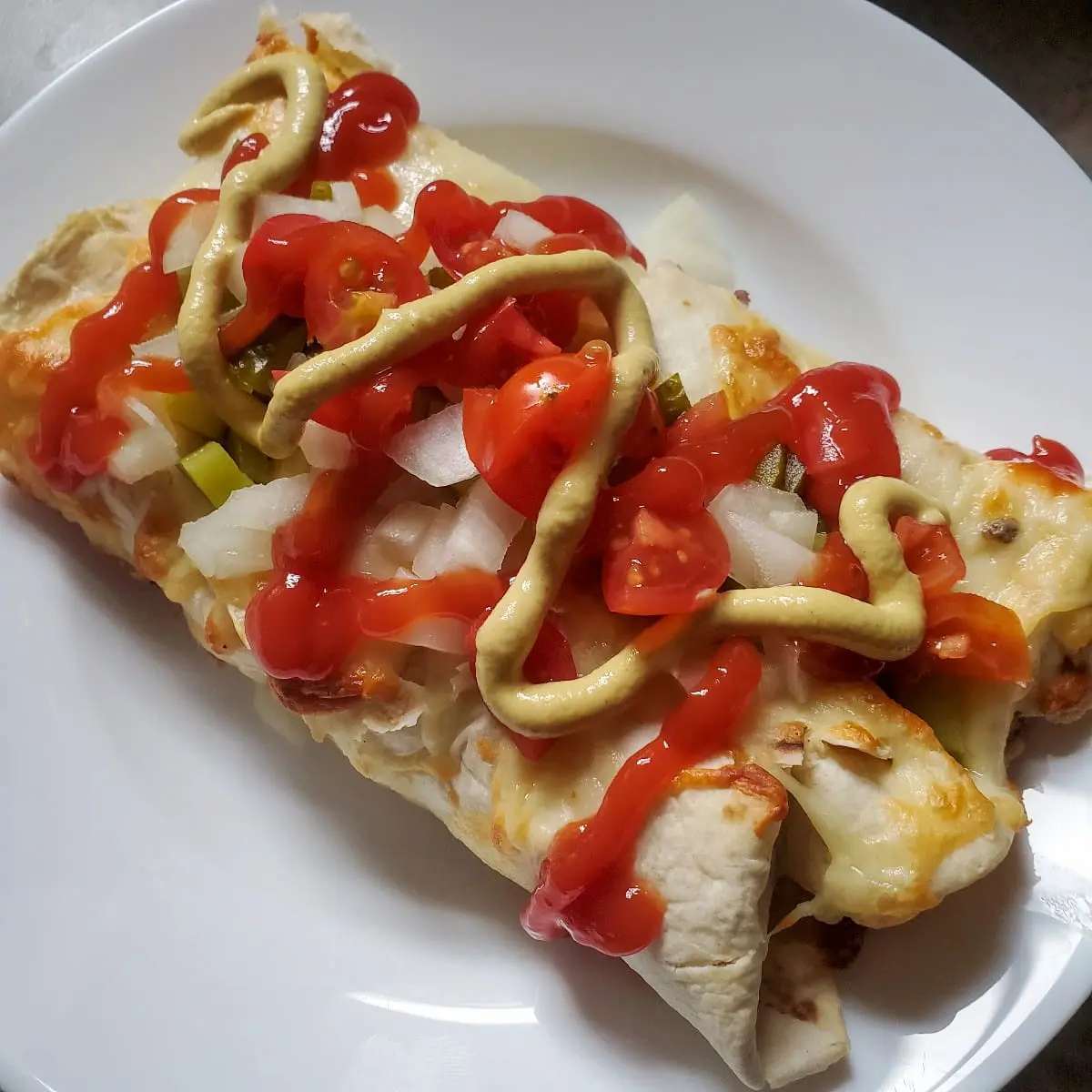 cheeseburger enchiladas cleveland cooking. cheese burger enchiladas loaded with cheese and beef. topped with ketchup, mustard, onions and anything else you like!