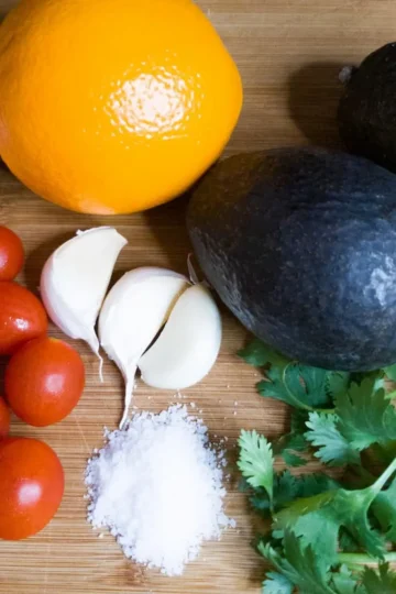 Guacamole with Orange Juice Recipe. Tomatoes, garlic, an orange, avocado, and cilantro. Recipe by Cleveland Cooking