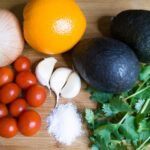 Guacamole with Orange Juice Recipe. Tomatoes, garlic, an orange, avocado, and cilantro. Recipe by Cleveland Cooking