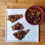 olive and sundried tomato tapenade on seed crackers. Diced olives,