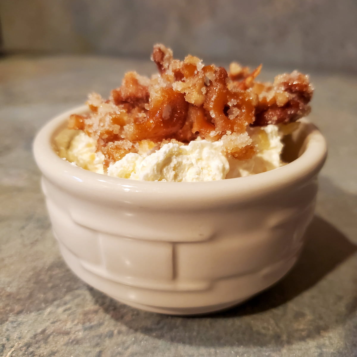 pineapple pretzel fluff recipe in a small custard cup.