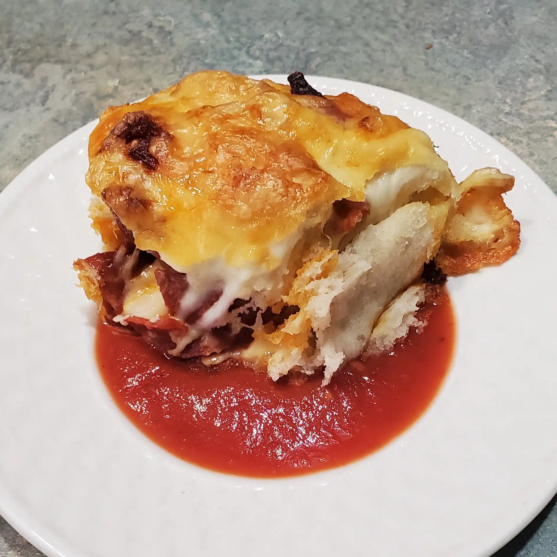 pizza roll from cleveland cooking in pizza sauce