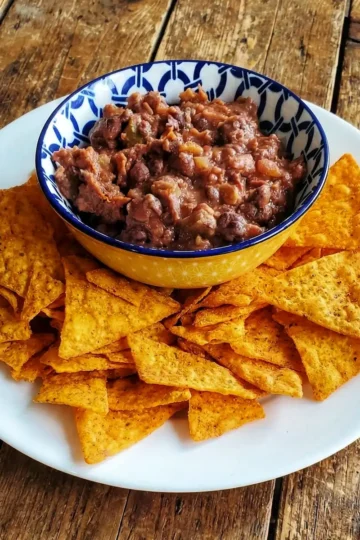 bowl of refried beans and salsa with tortilla chips. recipe from Cleveland cooking