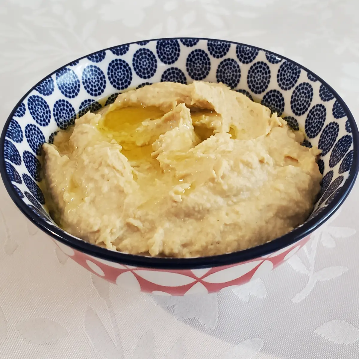 roasted garlic hummus with a bit of olive oil drizzled on top from cleveland cooking