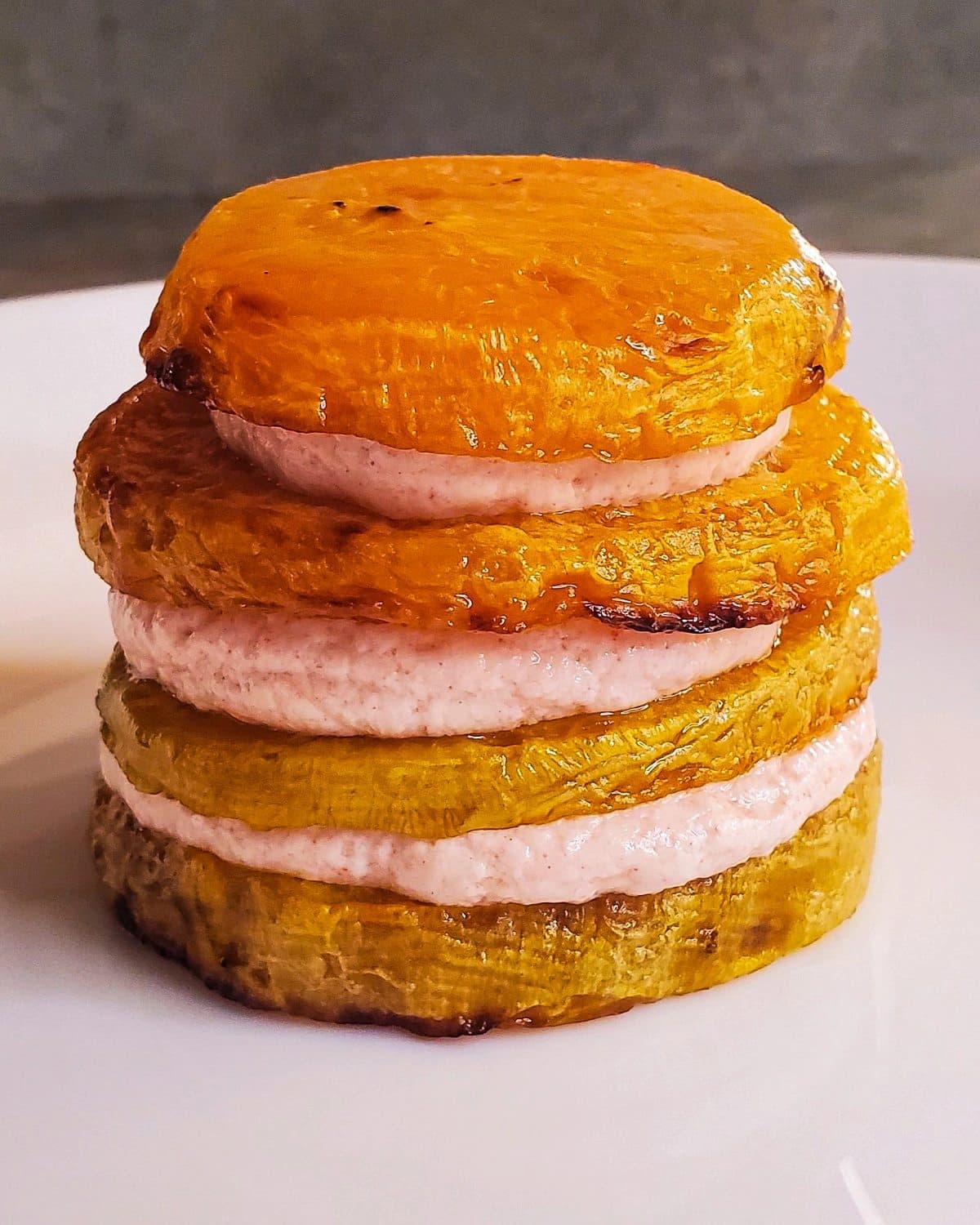 Roasted yellow beets layered with red plum goat cheese sauce