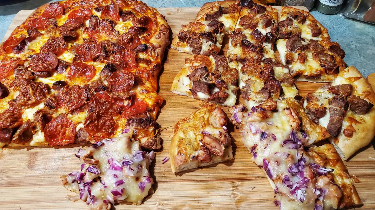 pepperoni, BBQ, and a sausage pizza made on a pizza night at my house using the pizza Dough recipe. 
