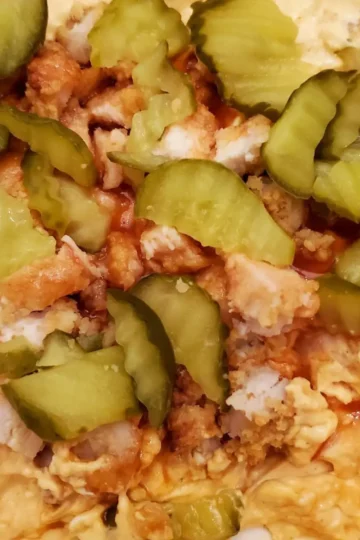 Nashville hot chicken dip from Cleveland Cooking. Chicken, hot sauce, cream cheese and pickles. Great party dip!