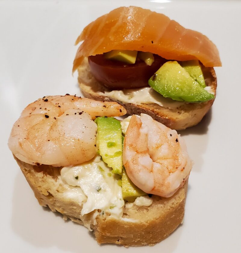 Shrimp and smoked salmon baguettes with avocado and tomato. And a roasted garlic spread from Cleveland cooking