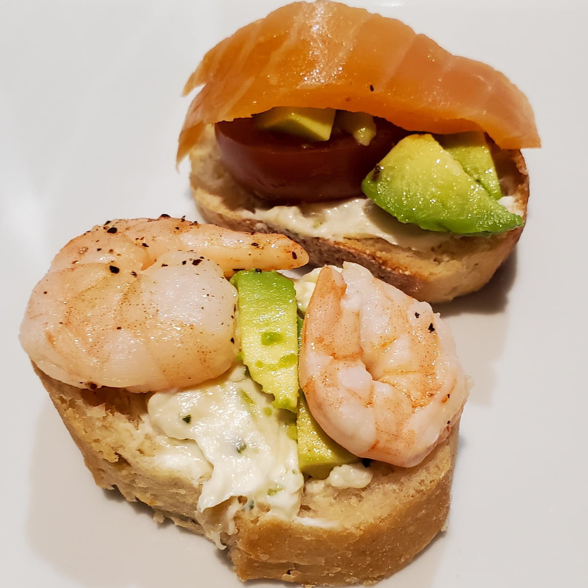 Shrimp and smoked salmon baguettes with avocado and tomato. And a roasted garlic spread from Cleveland cooking