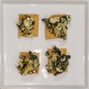 simple spanakopita dip recipe from Cleveland cooking. spinach, onion, and feta mixed and served on a cracker.