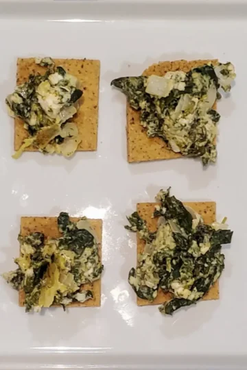 simple spanakopita dip recipe from Cleveland cooking. spinach, onion, and feta mixed and served on a cracker.