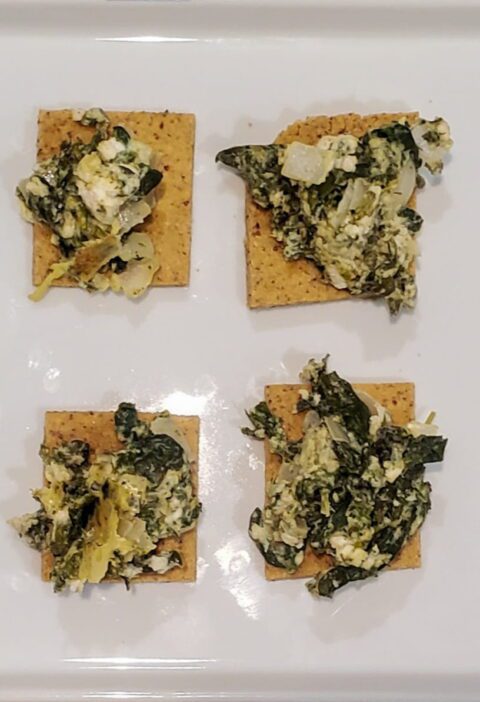 Spanakopita dip on a gluten free cracker from cleveland cooking