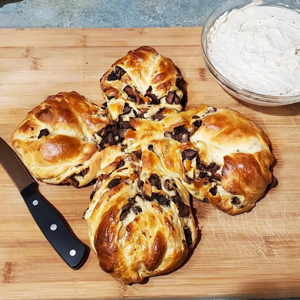 Star bread made with Quick Sweet Bread Recipe from Cleveland cooking. soft sweet bread filled with savory meat and cheese.
