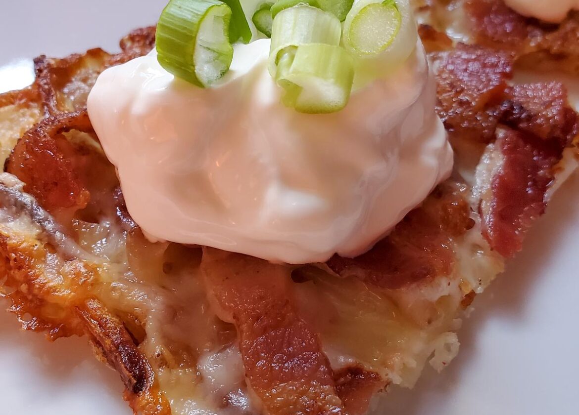 Loaded Hashbrown squares from cleveland cooking. Baked hash browns with cheese, bacon, sour cream, and scallions.