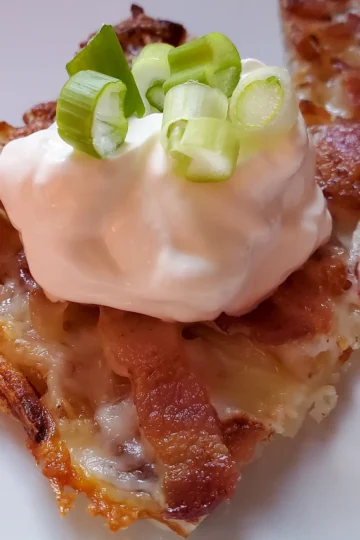 loaded hash brown recipe Cleveland cooking. loaded hash browns with a spoonful of sour cream on top.