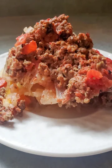 Unstuffed cabbage Cleveland cooking. stuffed cabbage a different way. ground beef topped with cabbage, tomatoes, and sauerkraut.