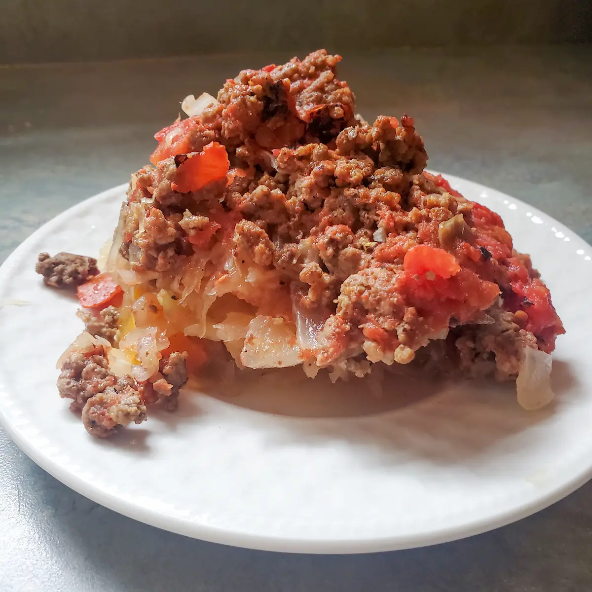 Unstuffed cabbage Cleveland cooking. stuffed cabbage a different way. ground beef topped with cabbage, tomatoes, and sauerkraut.