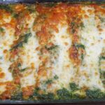 Roasted poblano enchiladas a with a chicken and cheese filling and roasted poblano cheese sauce on top.