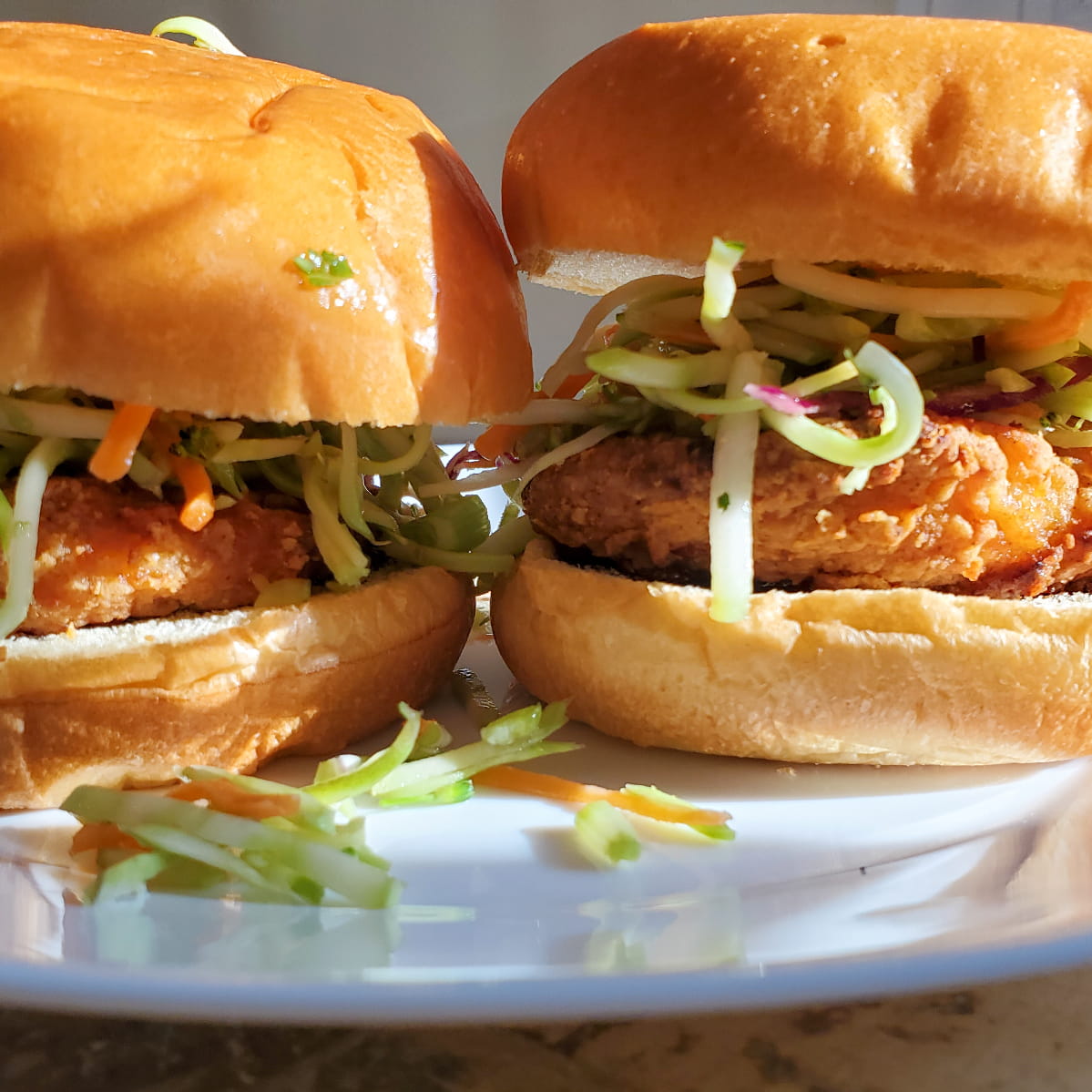 Asian barbeque sandwiches with asian bbq sauce, asian slaw, chicken and a bun