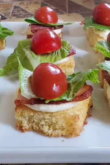 mini BLT appetizers from Cleveland cooking. brioche bread, bacon, lettuce, and tomato. Great for appetizers, parties, and your grazing Table.