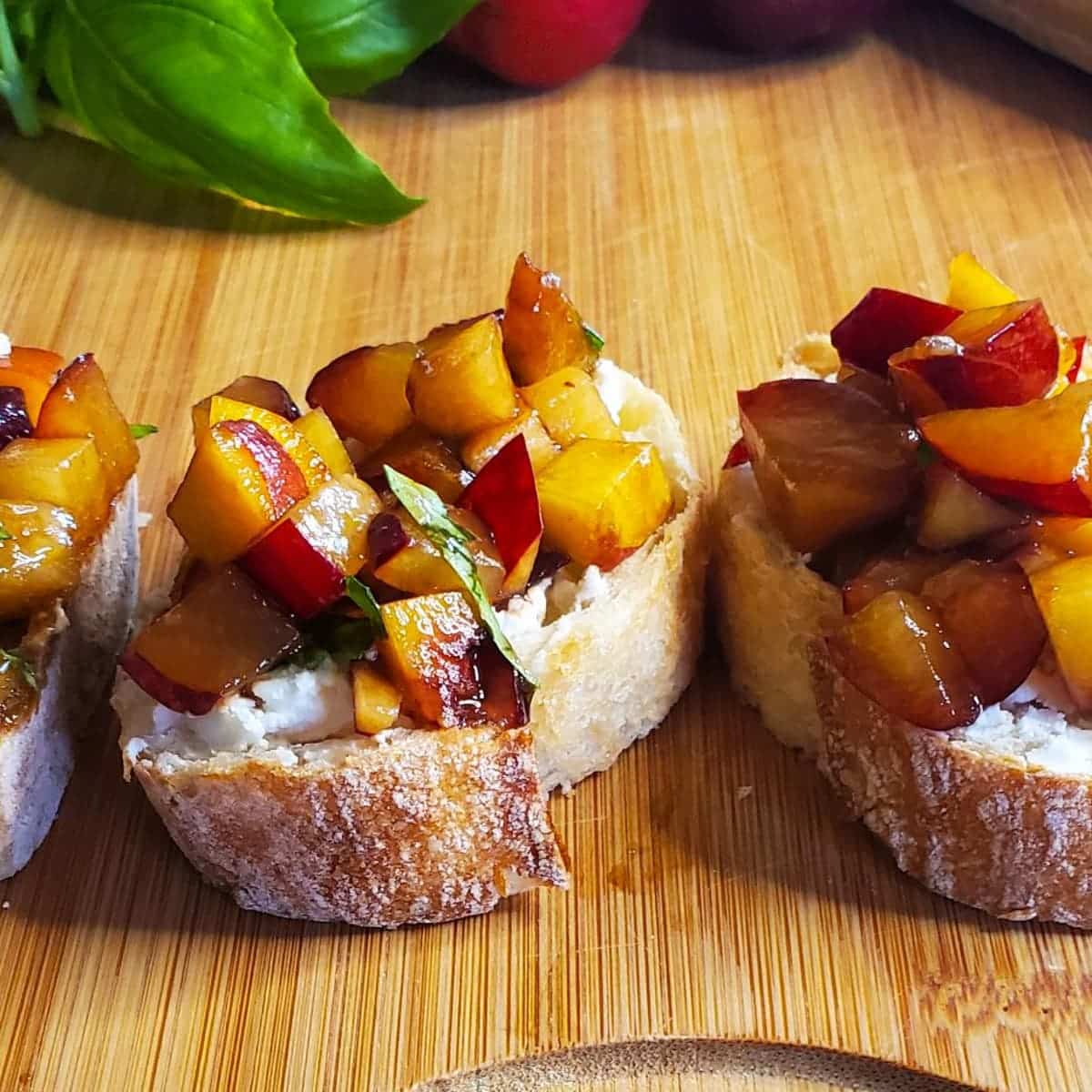 plum and peach bruschetta with basil and goat cheese from cleveland cooking