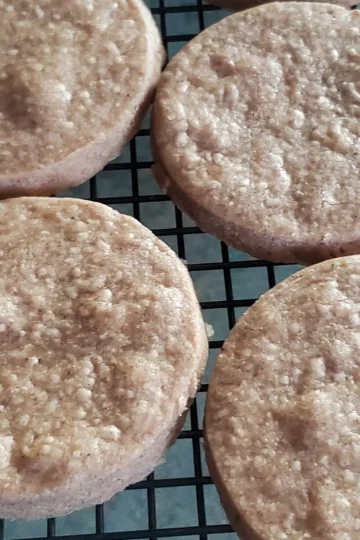 Pumpkin spice shortbread fresh from the oven cooking on a rack.