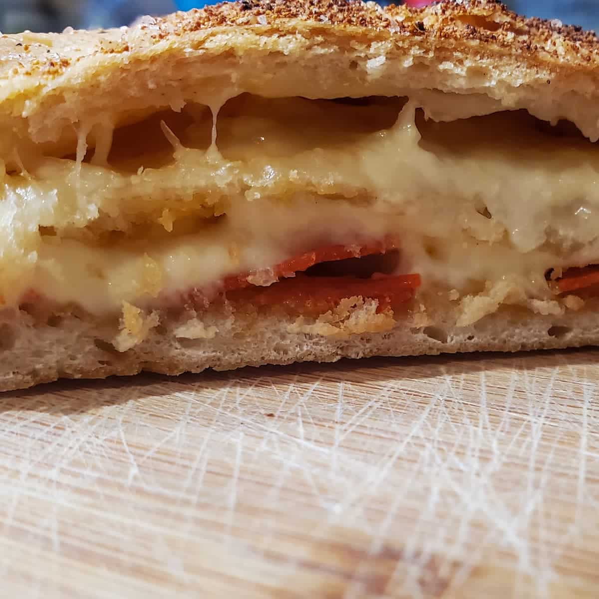 Pepperoni bread fresh from the oven with a spiced top, melty mozzarella cheese, and pepperoni. From Cleveland Cooking