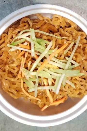 easy vegan ramen sauce on ramen noodles with carrots and broccoli strips. Recipe from cleveland cooking.