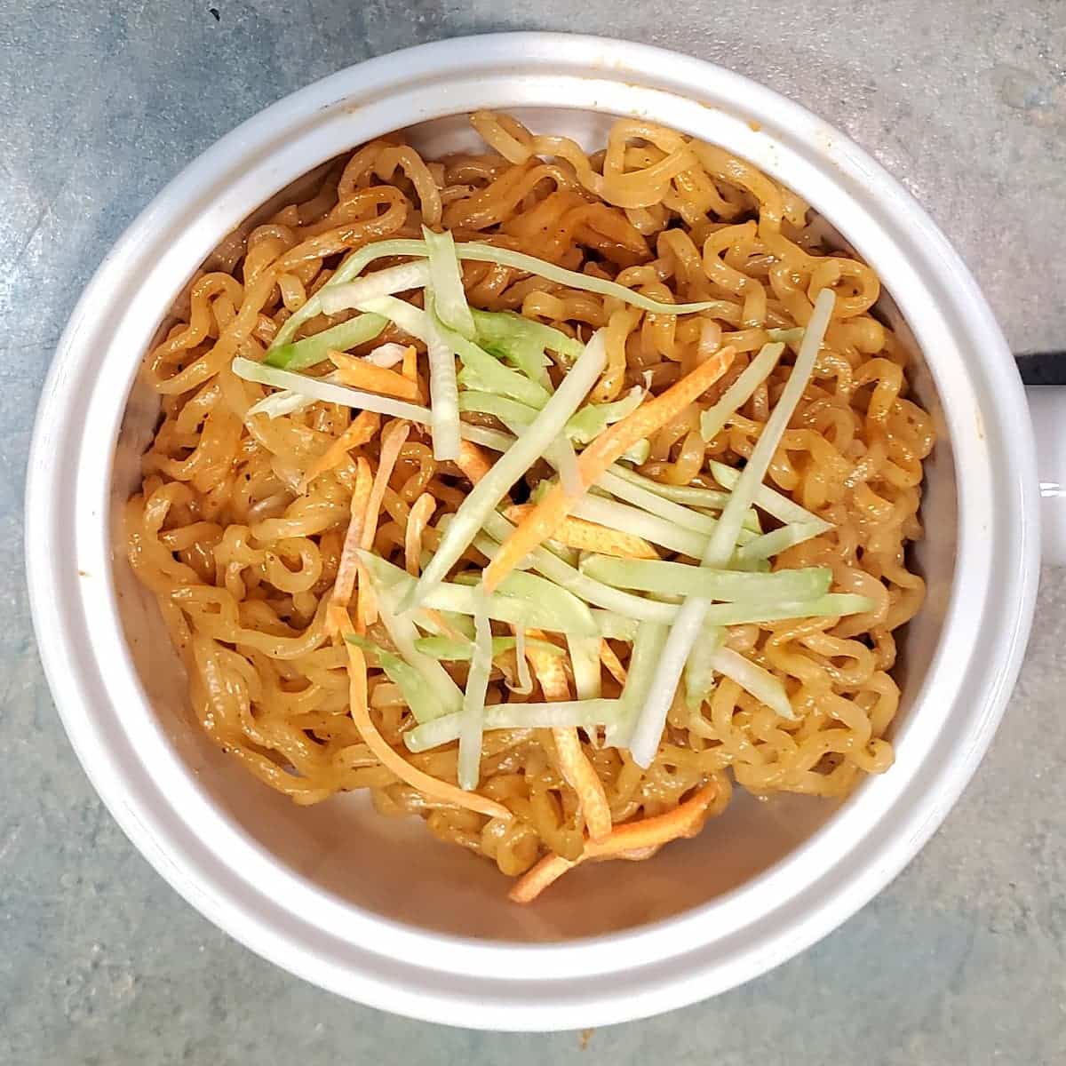 easy vegan ramen sauce on ramen noodles with carrots and broccoli strips. Recipe from cleveland cooking.