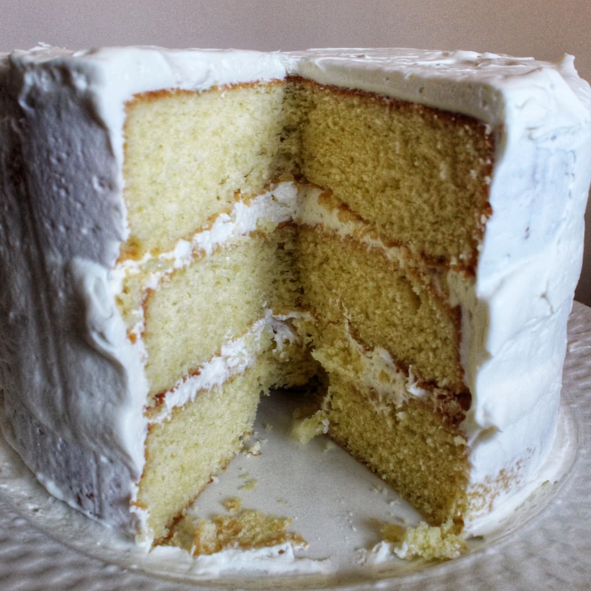 A three layer vanilla cake with american buttercream frosting. The buttercream recipe is by cleveland cooking.
