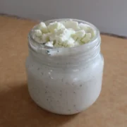 blue cheese dressing from Cleveland cooking. Blue cheese dressing in a jar with crumbled blue cheese on top.