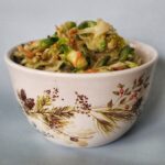 Miso and tahini slaw with Brussels sprouts, celeriac, and toasted sesame oil. Recipe from Cleveland cooking