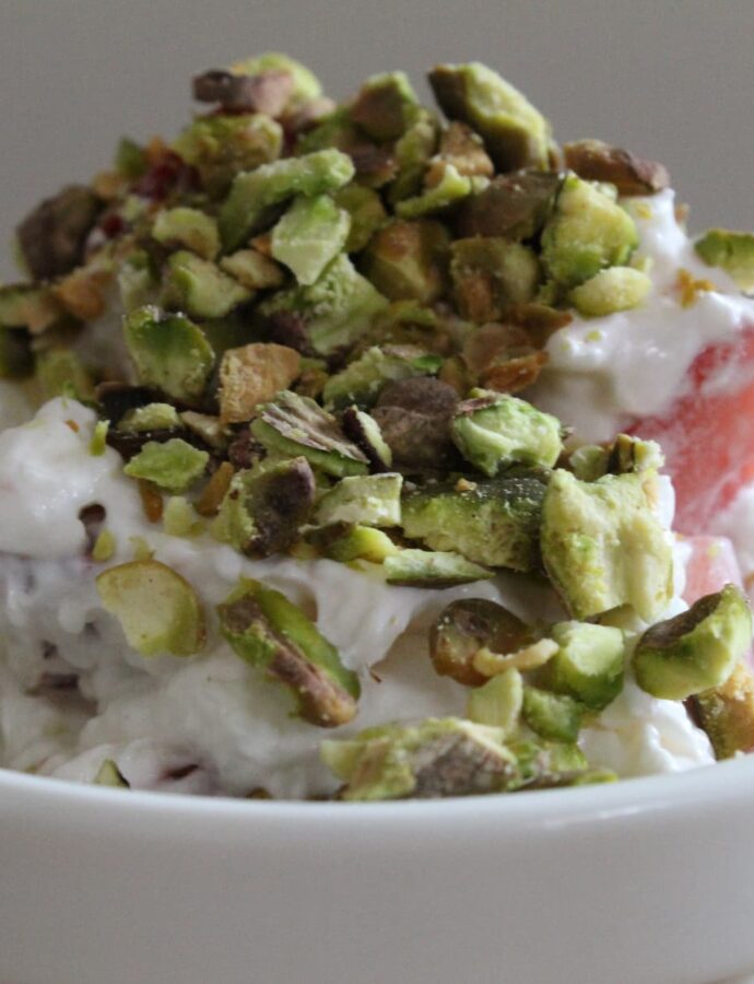 crumbles pistachios, whipped cream with cream cheese and sugar, and chopped strawberries make Strawberry Pistachio Fluff from Cleveland cooking.