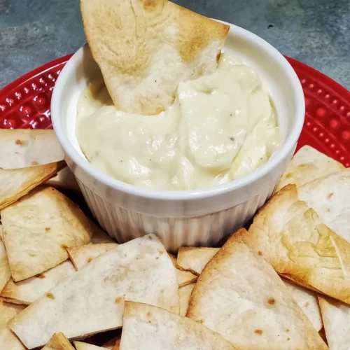 cheese sauce recipe by Cleveland cooking. Cheese sauce served in a bowl with tortilla chips.