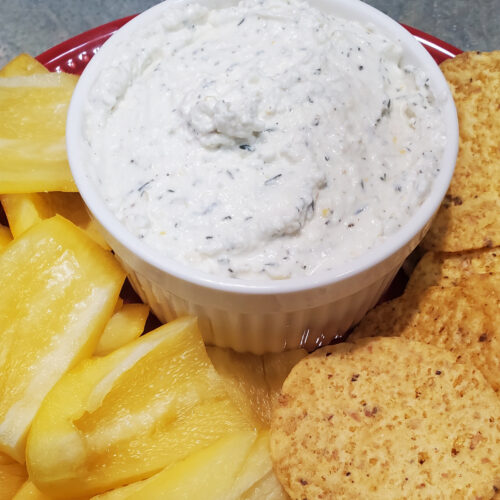 feta dip with lemon and thyme by Cleveland cooking. dip is served with peppers and chips