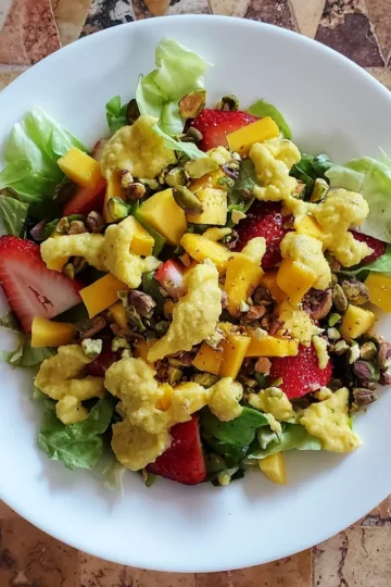 This strawberry, mango, and pistachio salad by Cleveland cooking will give you a burst of summer.