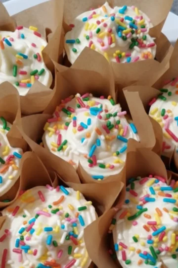 Simple vanilla cupcake recipe. vanilla cupcakes with white frosting and sprinkles from Cleveland cooking