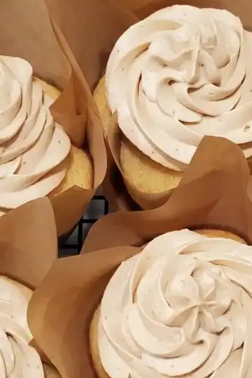 whipped peanut butter frosting from Cleveland cooking. a three tiered chocolate cake with whipped peanut butter frosting.