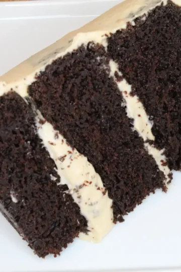 whipped peanut butter frosting from Cleveland cooking. a three tiered chocolate cake with whipped peanut butter frosting.