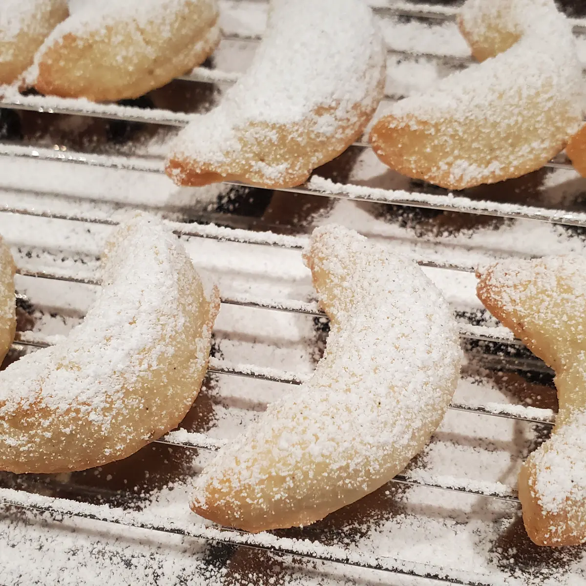 vanillekipferl german vanilla crescents cleveland cooking. German vanilla cookies fresh from the oven and powdered with vanilla powdered sugar.