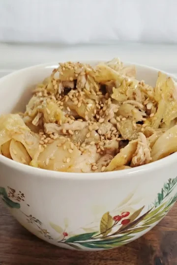 sesame ginger chicken served in a bowl with sesame seeds on top. Cleveland cooking