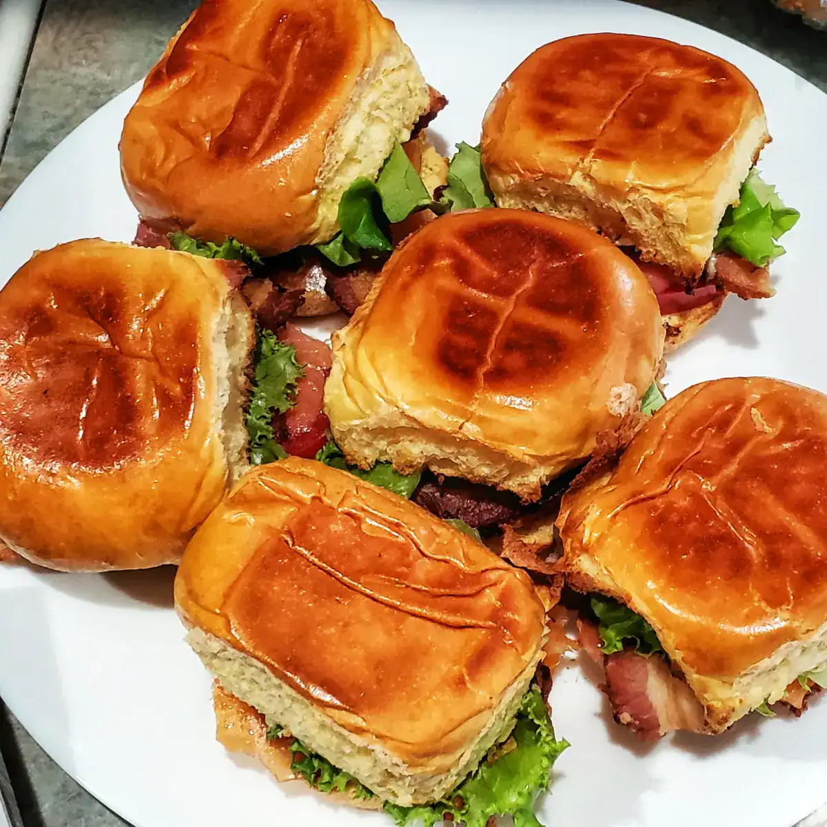 smoked salmon BLT sliders. 6 sliders with smoked salmon, bacon, lettuce, tomato, and mayonnaise. Cleveland cooking