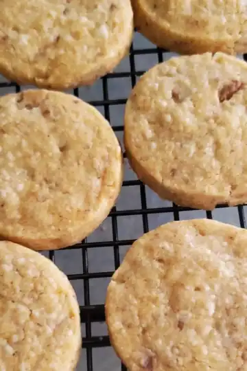 blue cheese and walnut crackers cooling on a black wire cooling rack